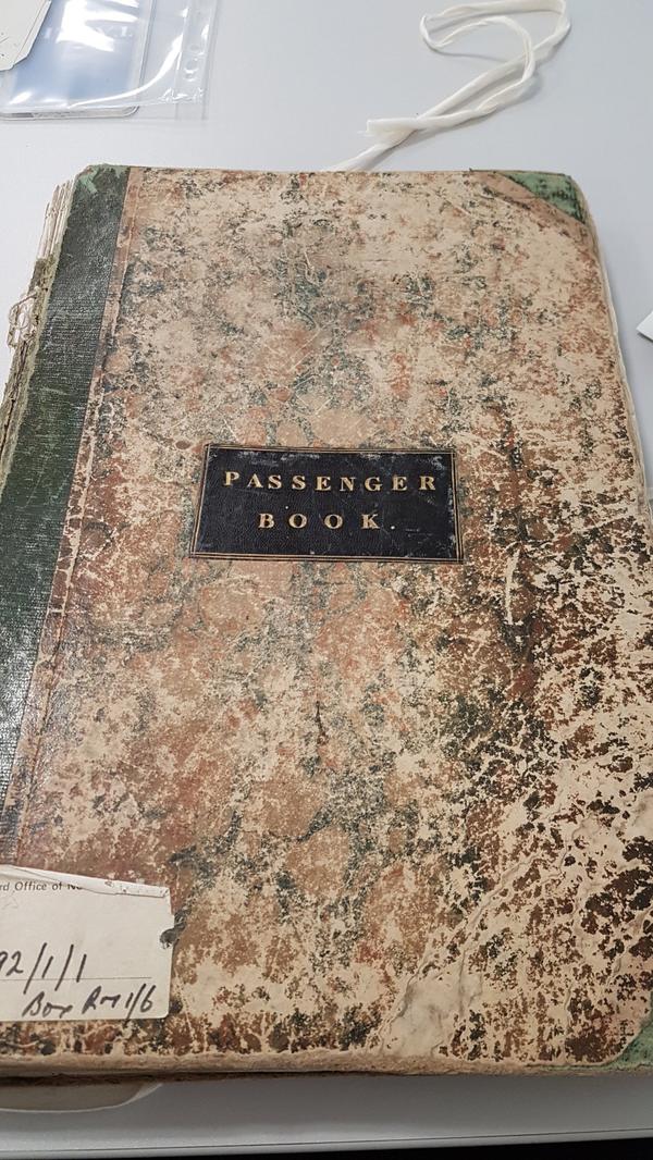 Marbled cover of a bound ledger labelled Passenger Book